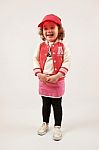 Little Girl Fashion Model With Red Cap Stock Photo