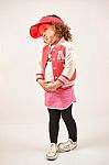 Little Girl Fashion Model With Red Cap Stock Photo