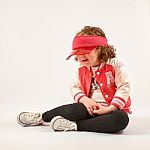 Little Girl Fashion Model With Red Cap Stock Photo