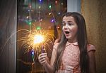 Little Girl Holding A Sparkler Stock Photo