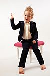 Little Girl In Black Suit Stock Photo