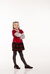 Little Girl In Red Dress Posing Standing In Studio Stock Photo