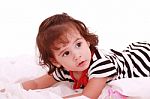 Little Girl Lying On Bed Stock Photo