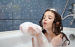 Little Girl Playing With Soap Bubbles Stock Photo