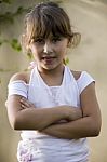 Little Girl With Crossed Arms Stock Photo