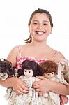 Little Girl With Dolls Stock Photo