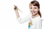 Little Girl With Painting Stock Photo