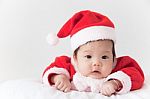 Little Girl With Santa Costume Stock Photo