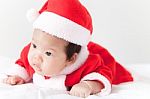 Little Girl With Santa Costume Stock Photo