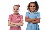 Little Girls Posing With Arms Crossed Stock Photo