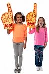 Little Girls Raises Arms With Foam Finger Stock Photo