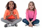 Little Girls Sitting On Floor Stock Photo