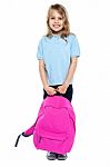 Little Schoolgirl Posing With Pink Backpack Stock Photo