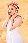 Lonely Beautiful Young Blonde Girl In White Dress With Straw Hat Stock Photo