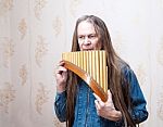 Long-haired Elderly Man With Pan Flute Stock Photo