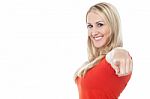 Lovely Casual Woman Pointing Towards Camera Stock Photo