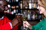 Lovely Couple Enjoying Drinks At Night Club Stock Photo