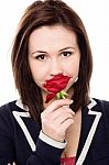 Lovely Young Girl With A Beautiful Red Rose Stock Photo