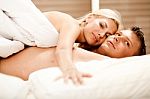 Lovers Relaxing In Bed Stock Photo