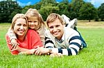 Lying Family In Outdoors Stock Photo