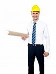 Male Builder Holding Blueprints Stock Photo