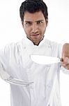 Male Chef Holding Cutlery Stock Photo