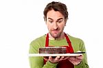 Male Chef Holding Yummy Chocolate Cake Stock Photo