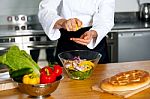 Male Chef Put Ingredient In The Glass Bowl Stock Photo