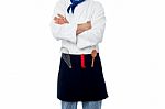 Male Chef With Kitchen Utensils Stock Photo