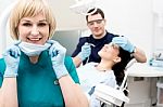 Male Dentist Doing Teeth Checkup Behind Stock Photo