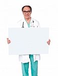 Male Doctor Holding White Board Stock Photo