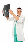 Male Doctor holding X Ray Stock Photo