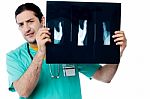 Male Doctor Observing X Ray Image Stock Photo