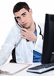 Male Doctor Speaking Over Telephone Stock Photo