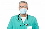 Male Doctor With Face Mask Stock Photo