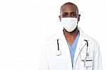 Male Doctor With Face Mask Stock Photo