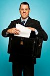 Male Executive Arranging Papers Stock Photo