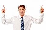 Male Executive Pointing Upwards Stock Photo