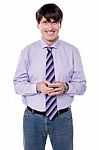 Male Executive Sending  Sms With His Phone Stock Photo