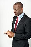 Male Executive Using His Mobile Phone Stock Photo