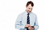 Male Executive Using Is Cell Phone Stock Photo