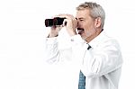 Male Executive With Binocular Stock Photo