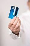 Male Hand Holding A New Cash Card Stock Photo