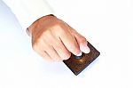 Male Hand Holding Rubber Stamp Stock Photo