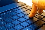 Male Hand Typing On Laptop Stock Photo