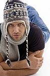 Male Lying And Wearing Woolen Cap Stock Photo