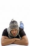 Male Lying And Wearing Woolen Cap Stock Photo