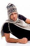 Male Lying And Wearing Woolen Cap Stock Photo