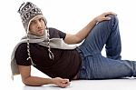 Male Lying And Wearing Woolen Cap Stock Photo