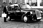 Male Passenger Opening Cab Door Stock Photo